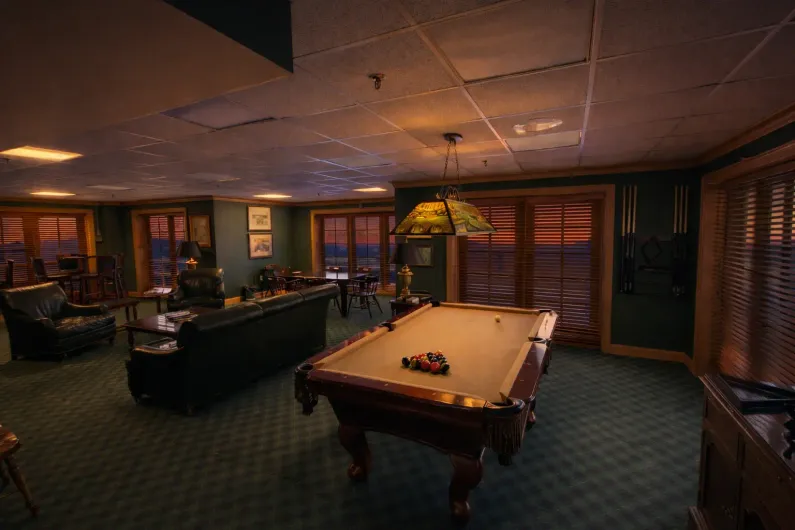 Image of a gym mirror with a bench press, treadmill, dumbbells, and kettlebells. 