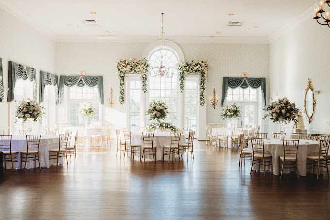 Elegant wedding reception setup at Danville Golf Club with beautiful table settings and ambient lighting